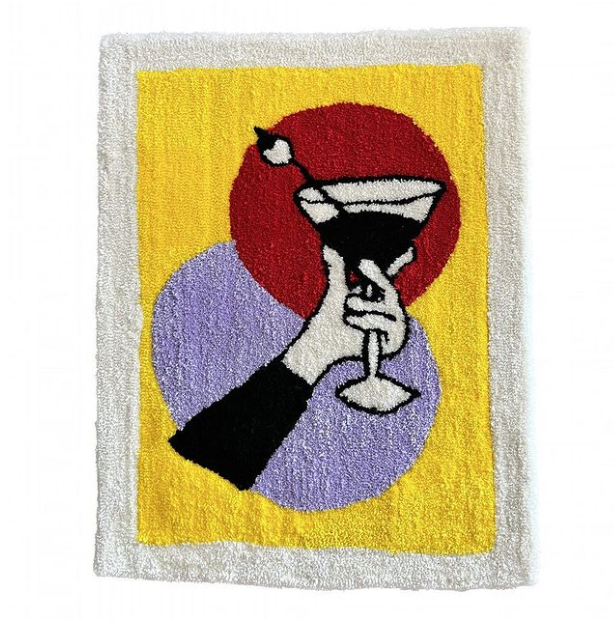 A hand with a black sleeve raises a Martini Glass. Behind the glass is a lilac oval and a red circle. A Yellow rectangle with a white border